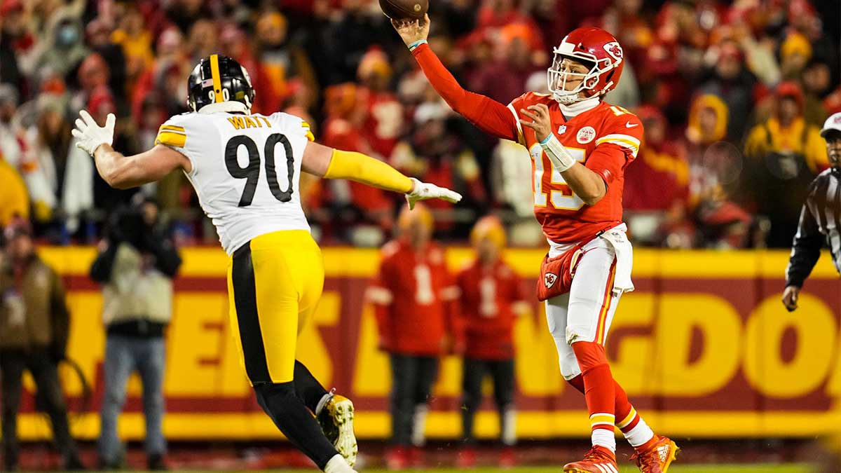 Jan 16, 2022; Kansas City, Missouri, USA; Kansas City Chiefs quarterback Patrick Mahomes (15) throws a pass as Pittsburgh Steelers outside linebacker T.J. Watt (90) defends during the first half in an AFC Wild Card playoff football game at GEHA Field at Arrowhead Stadium. Mandatory Credit: Jay Biggerstaff-Imagn Images