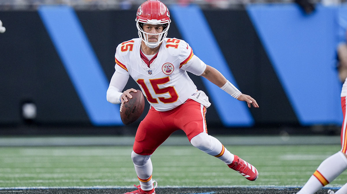 Kansas City Chiefs quarterback Patrick Mahomes (15) scrambles in the backfield against the Carolina Panthers during the second half at Bank of America Stadium.