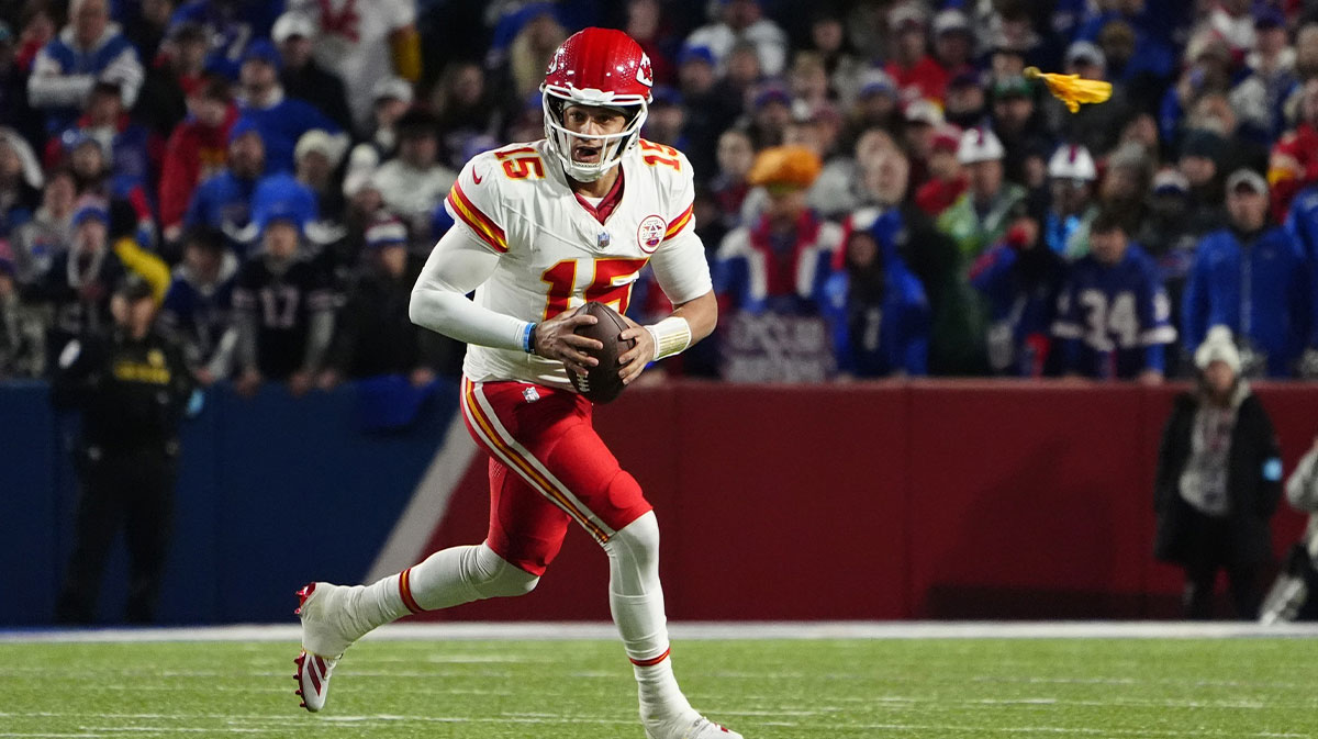 Kansas City Chiefs quarterback Patrick Mahomes (15) rolls out looking to throw the ball against the Buffalo Bills during the second half at Highmark Stadium.