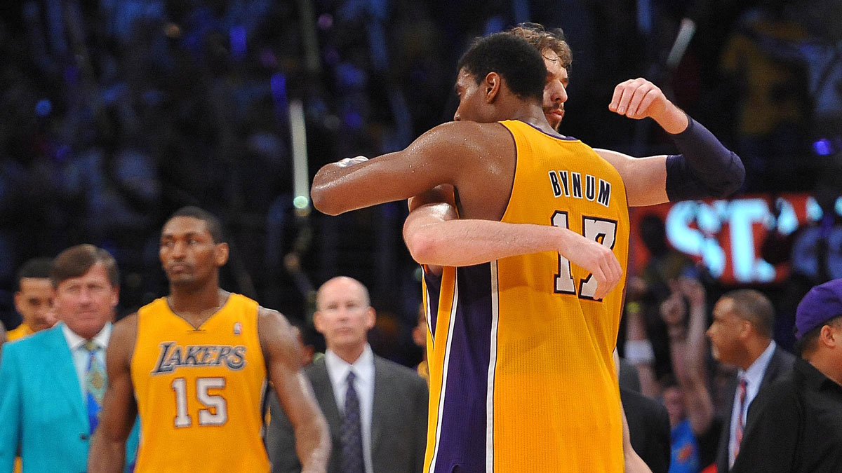 Los Angeles Lakers power forward Pau Gasol (16) and center Andrew Bynum (17) hug at the end of game seven of the Western Conference quarterfinals of the 2012 NBA Playoffs against the Denver Nuggets at the Staples Center. Lakers won 96-87.