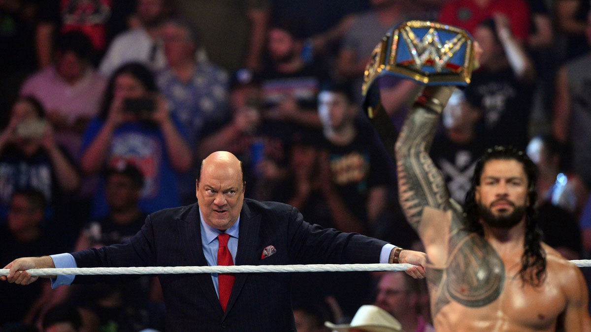Paul Heyman and Roman Reigns at Money in the Bank in 2021.