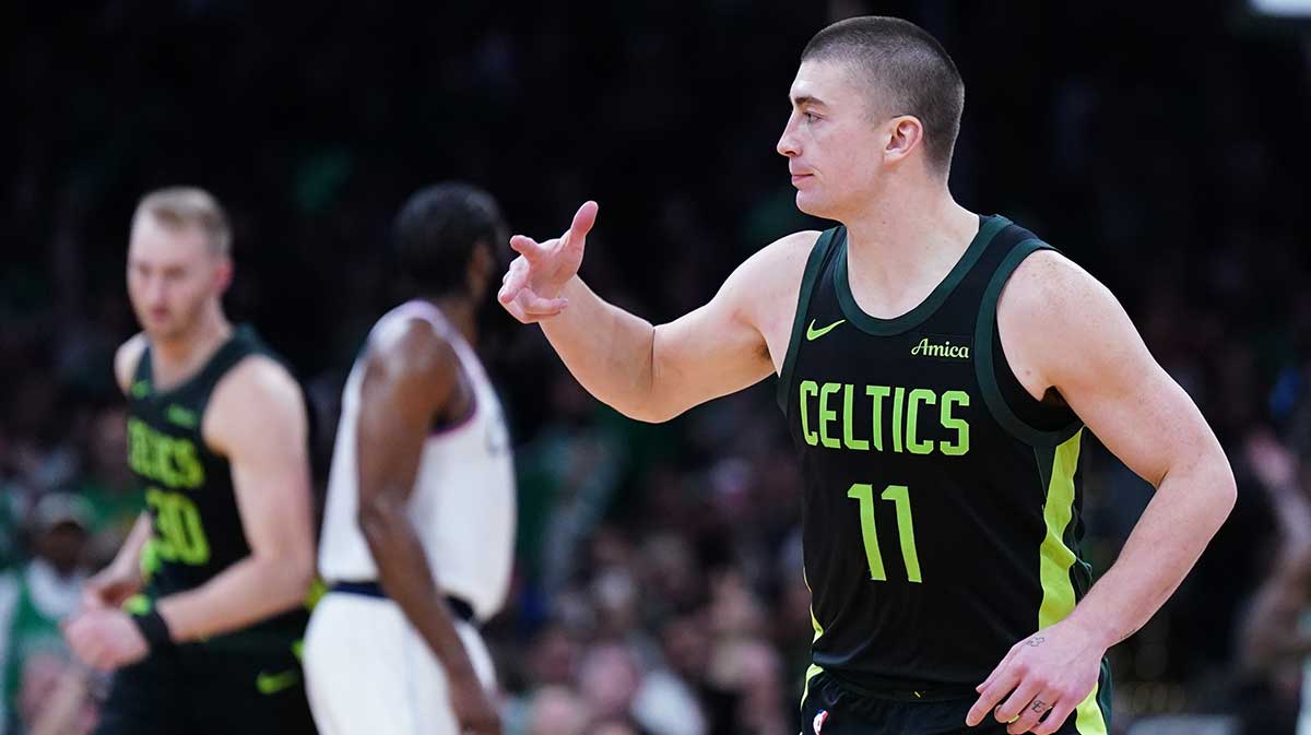 Boston Celtics guard Payton Pritchard (11) reacts after his three point basket against the LA Clippers in the second half at TD Garden. 