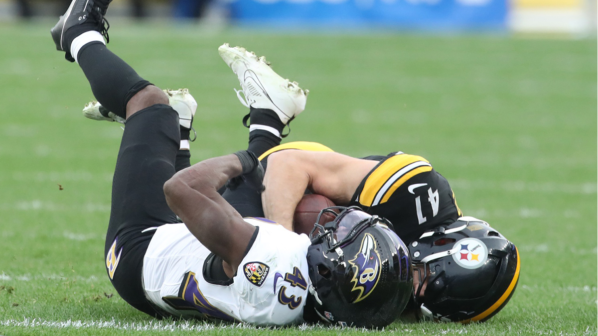 Pittsburgh Steelers linebacker Payton Wilson (41) strips the ball from Baltimore Ravens running back Justice Hill (43) for a fourth quarter interception at Acrisure Stadium