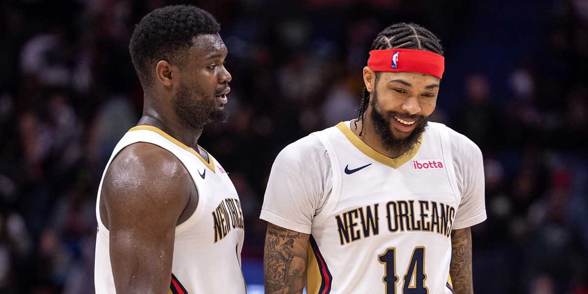 New Orleans Pelicans forward Zion Williamson (1) and forward Brandon Ingram (14) share a laugh after a play against the Los Angeles Lakers during the second half at Smoothie King Center