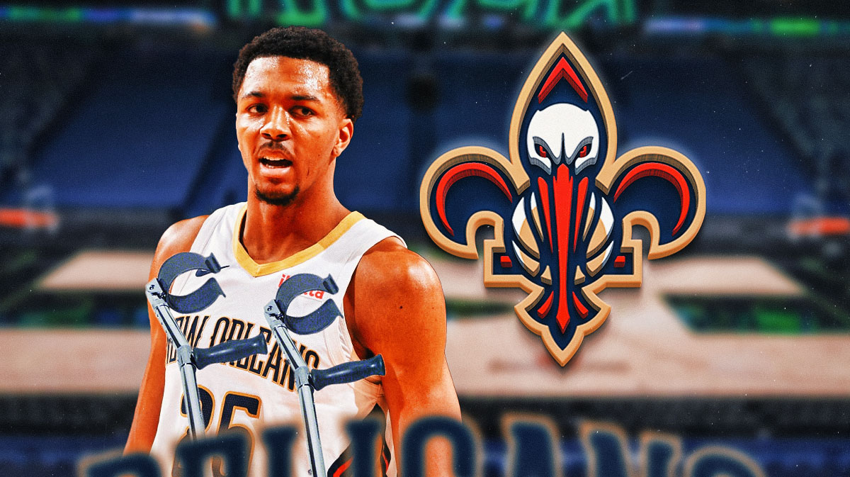 Trey Murphy III kicking over a set of crutches, Pelicans logo