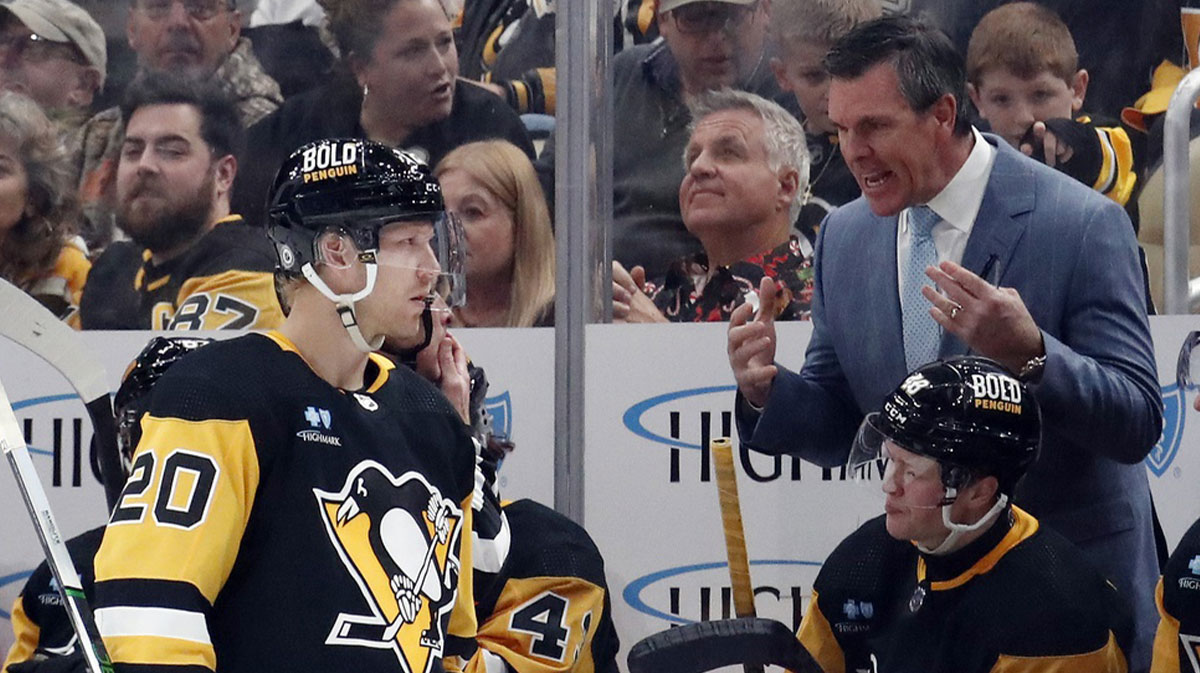 Pittsburgh Penguins head coach Mike Sullivan (right) talks with center Lars Eller (20) at the bench against the Minnesota Wild during the third period at PPG Paints Arena. Pittsburgh won 4-3.