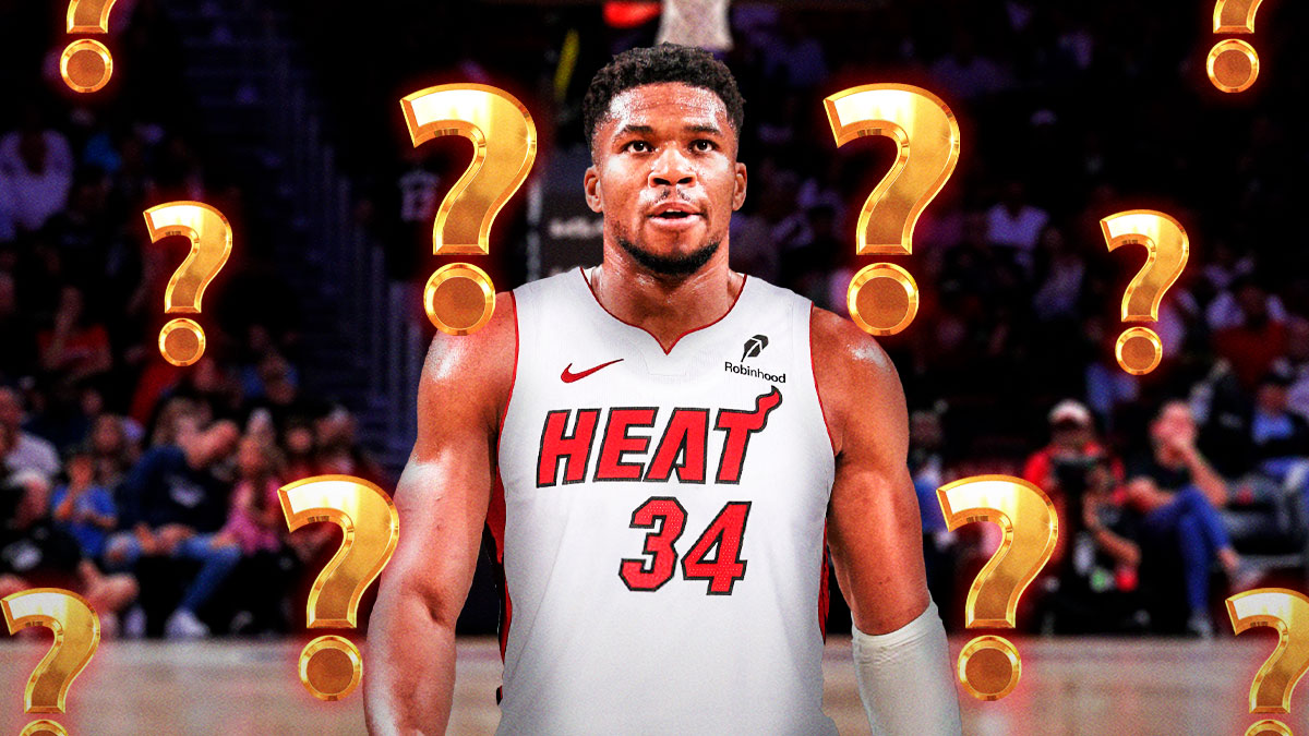 Bucks' Giannis Antetokounmpo in a Heat jersey with question marks all around.