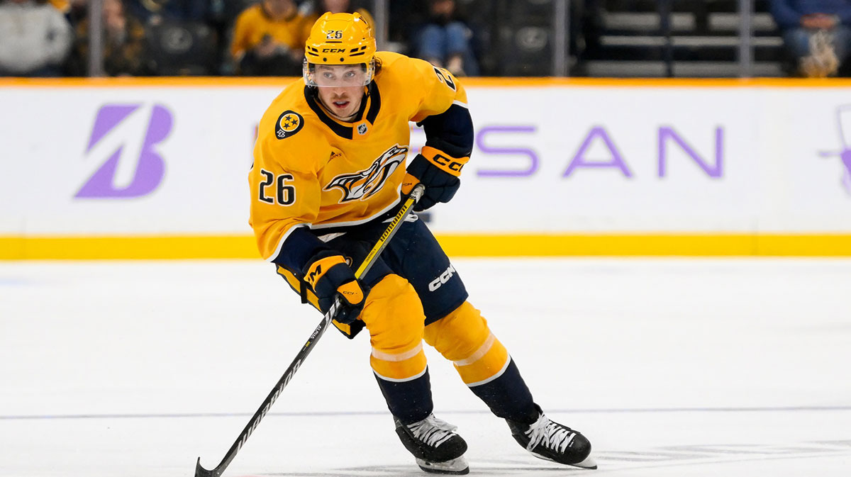 Nashville Predators center Philip Tomasino (26) skates with the puck against against the Utah Hockey Club during the third period at Bridgestone Arena.