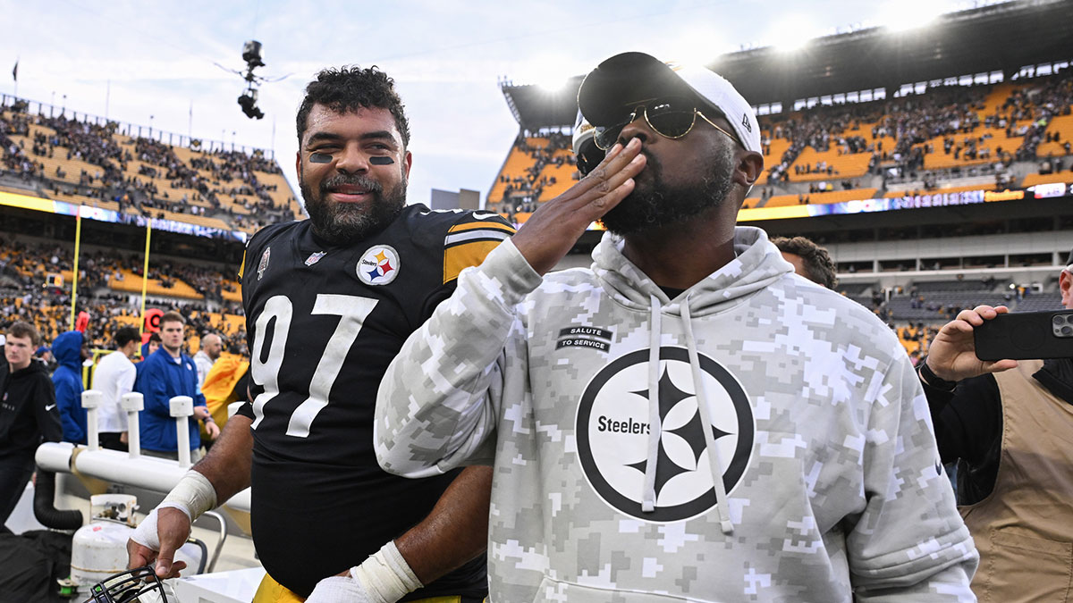 Pittsburgh Steelers head coach Mike Tomlin and defensive tackle Cameron Heyward (97) celebrate a 18-16 victory over the Baltimore Ravens at Acrisure Stadium.