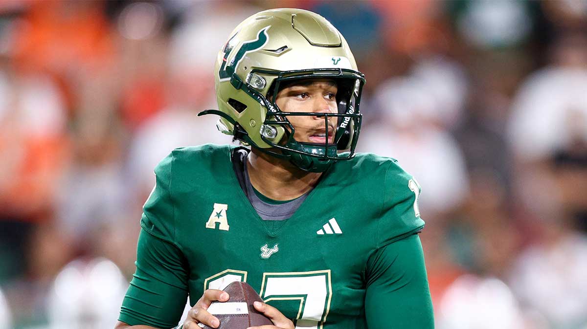 South Florida Bulls quarterback Byrum Brown (17) drops back to pass against the Miami Hurricanes in the third quarter at Raymond James Stadium.