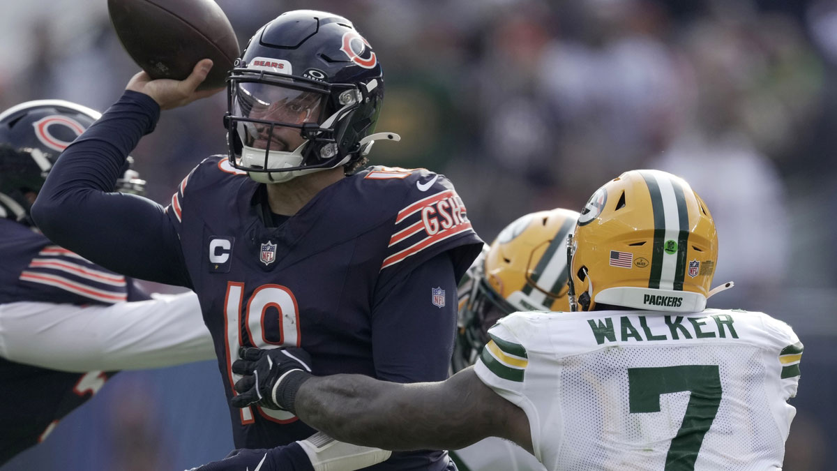 Chicago Bears quarterback Caleb Williams (18) is pressured by Green Bay Packers linebacker Quay Walker (7) during the third quarter of their game Sunday, November 17, 2024 at Soldier Field in Chicago, Illinois. The Green Bay Packers beat the Chicago Bears 20-19.