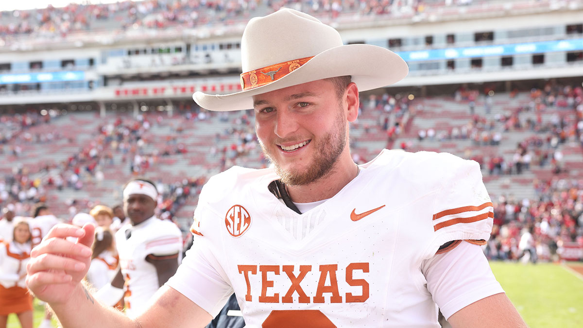 Texas Longhorns football quarterback Quinn Ewers (3) celebrates after the game against the Arkansas Razorbacks at Donald W. Reynolds Razorback Stadium. Texas won 20-10.