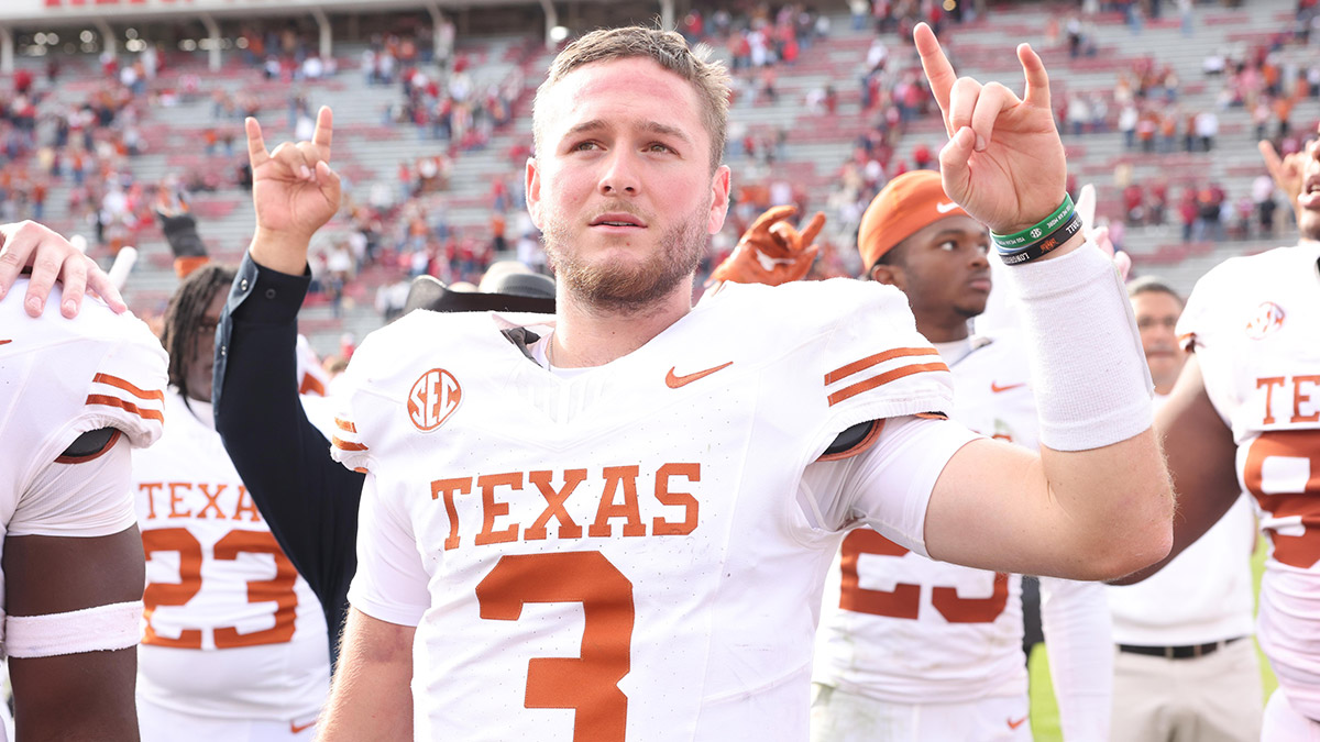 Texas Longhorns quarterback Quinn Ewers (3) celebrates after the game against the Arkansas Razorbacks at Donald W. Reynolds Razorback Stadium. Texas won 20-10.