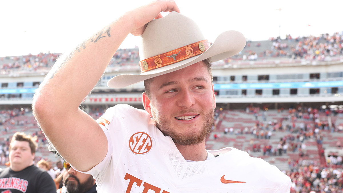 Texas Longhorns quarterback Quinn Ewers (3) celebrates after the game against the Arkansas Razorbacks at Donald W. Reynolds Razorback Stadium. Texas won 20-10