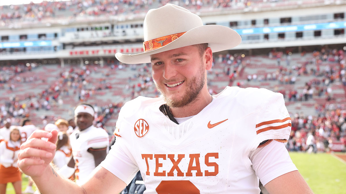 Texas Longhorns quarterback Quinn Ewers (3) celebrates after the game against the Arkansas Razorbacks at Donald W. Reynolds Razorback Stadium. Texas won 20-10.