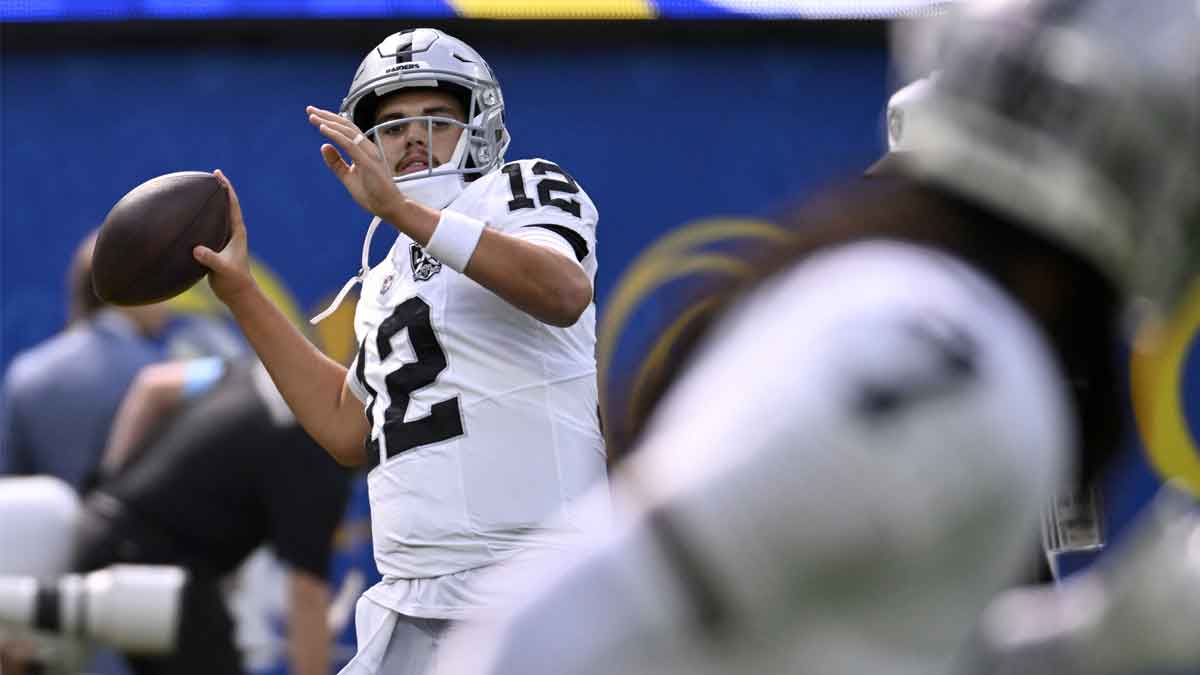 Las Vegas Raiders quarterback Aidan O'Connell (12) throws a pass during warmups before a game against the Los Angeles Rams at SoFi Stadium