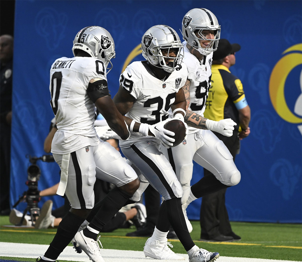 Las Vegas Raiders cornerback Nate Hobbs (39) celebrates intercepting a Los Angeles Rams quarterback Matthew Stafford (not pictured) pass during the third quarter at SoFi Stadium. Left is Las Vegas Raiders cornerback Jakorian Bennett (0), right is defensive end Maxx Crosby (98). 