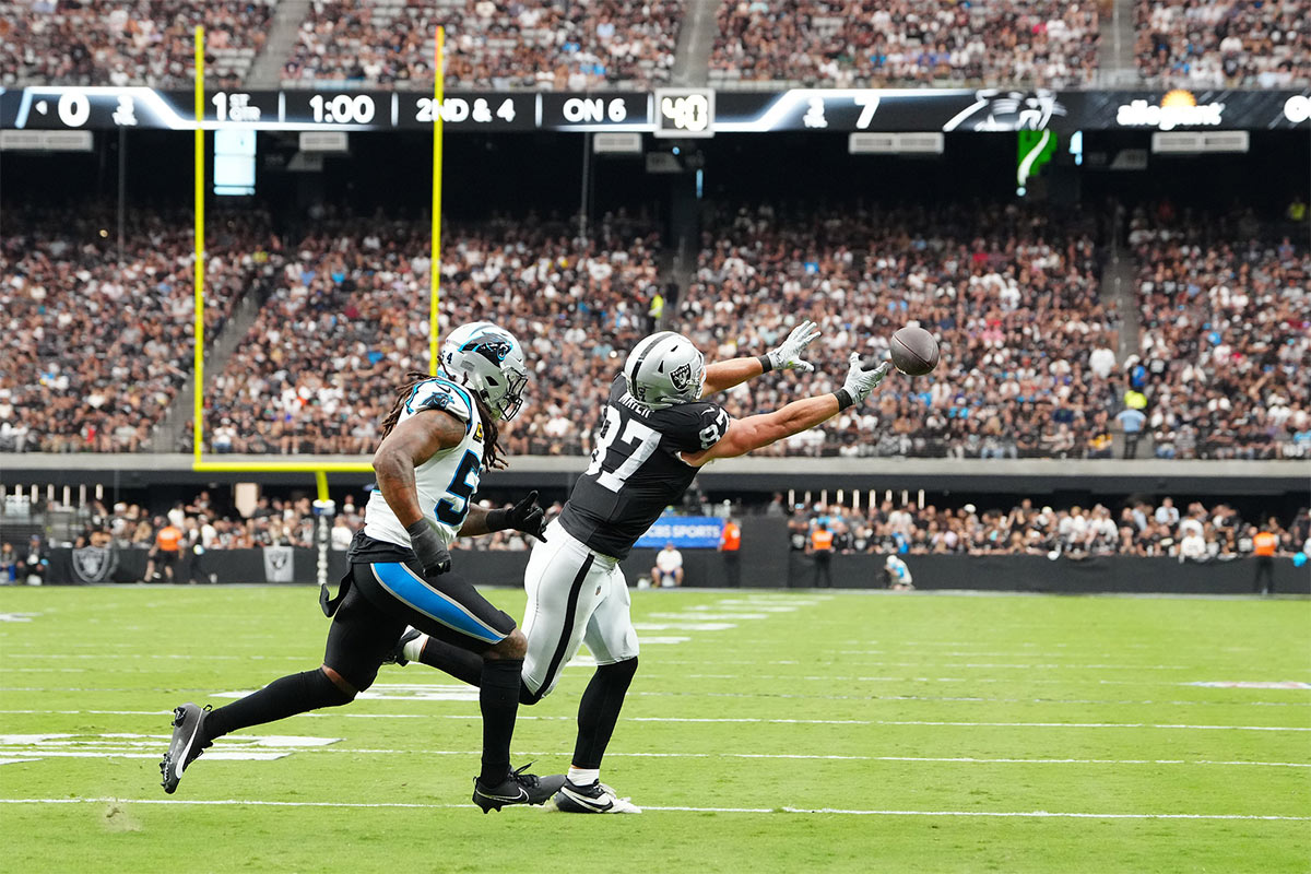 Las Vegas Raiders tight end Michael Mayer (87) misses a pass in front of Carolina Panthers linebacker Shaq Thompson (54) during the first quarter at Allegiant Stadium.