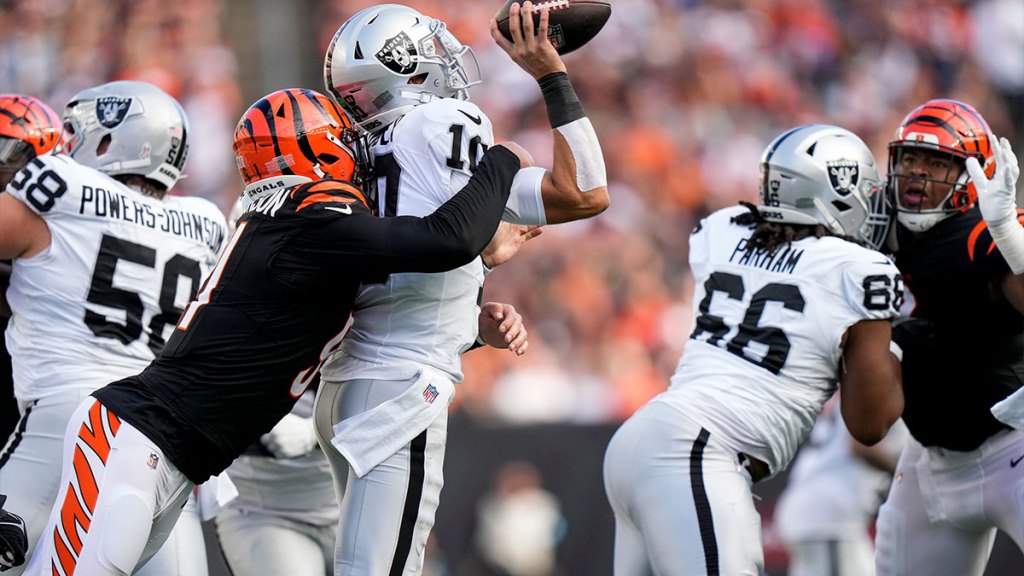 Cincinnati Bengals defensive end Trey Hendrickson (91) sacks Las Vegas Raiders quarterback Desmond Ridder (10) in the third quarter of the NFL Week 9 game between the Cincinnati Bengals and the Las Vegas Raiders at Paycor Stadium in downtown Cincinnati on Sunday, Nov. 3, 2024. The Bengals collected their first win at home with a 41-24 victory over the Raiders.