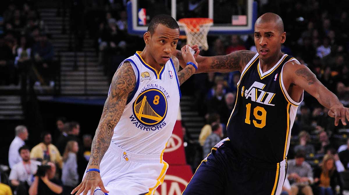 Gold State Warriors Shooting Garding Monte Ellis (8) Dribible Ball v. Utah Jazz Guard Raja Bell (19) During the first quarter in Oracle Arena. 