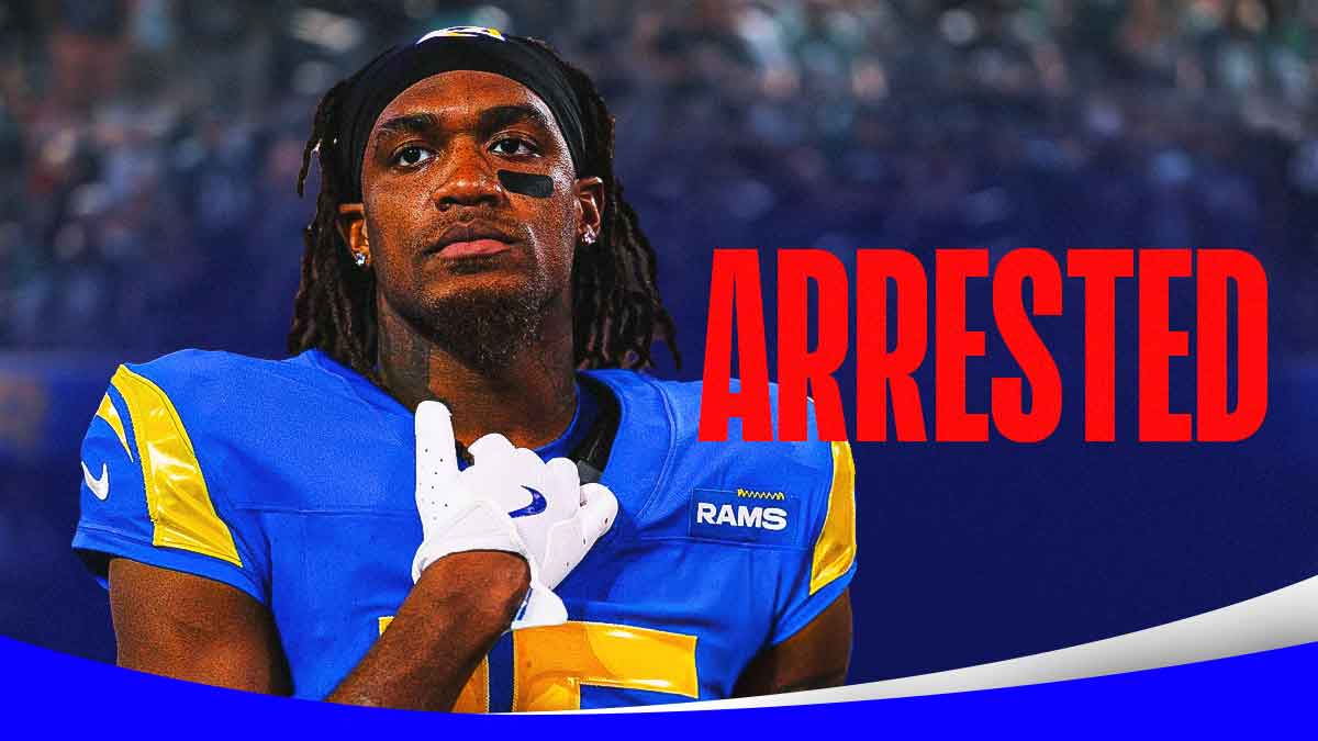 Demarcus Robinson with the word Arrested in red next to him in front of the Rams stadium
