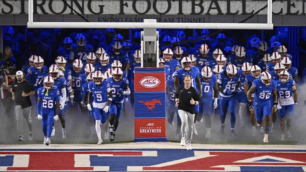Southern Methodist Mustangs head coach Rhett Lashlee leads the Mustangs on to the field to face the Pittsburgh Panthers at Gerald J. Ford Stadium.