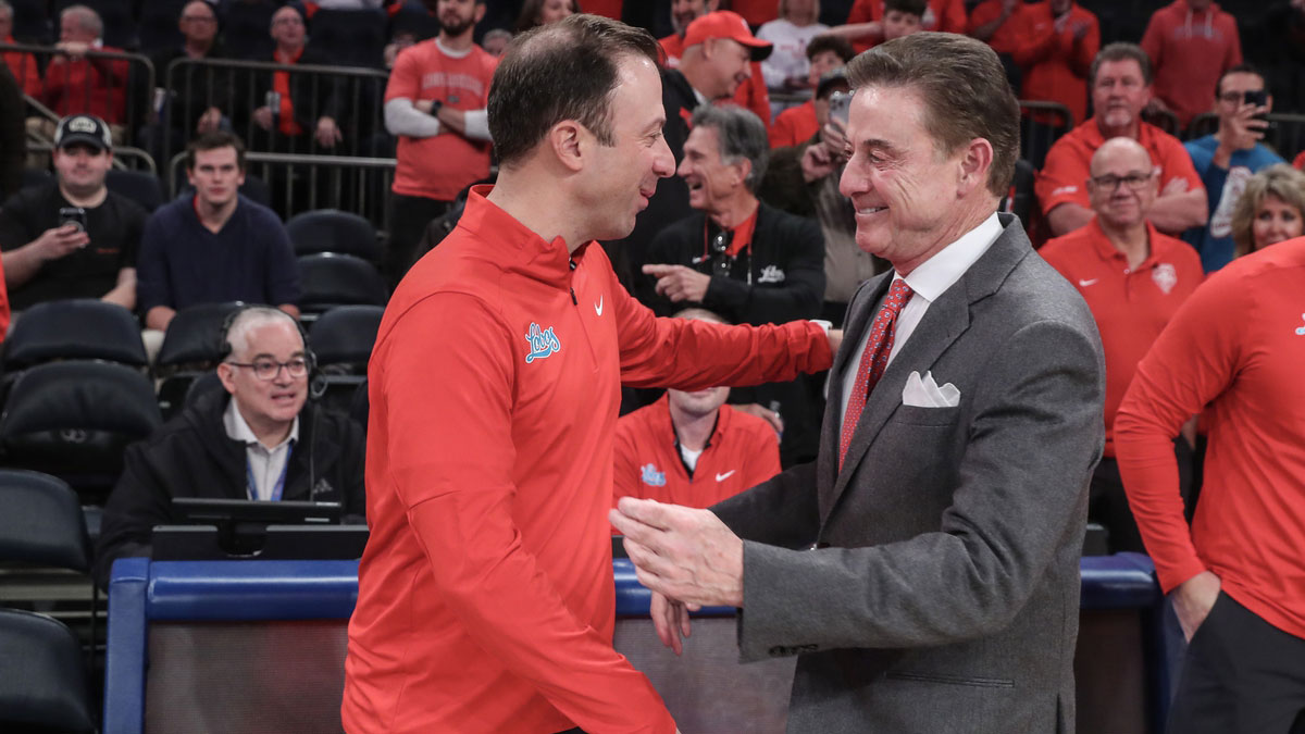 New Mexico Lobos head coach Richard Pitino and St. John's Red Storm head coach Rick Pitino greet each other prior to the start of the game at Madison Square Garden.