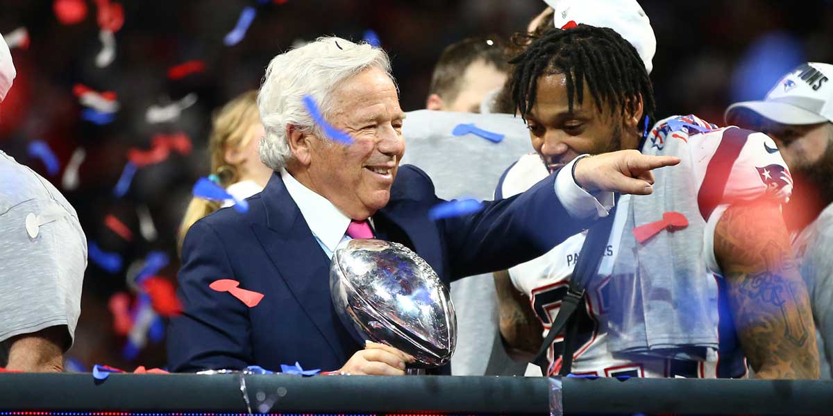 New England Patriots owner Robert Kraft celebrates with the Vince Lombardi Trophy after defeating the Los Angeles Rams in Super Bowl LIII at Mercedes-Benz Stadium.