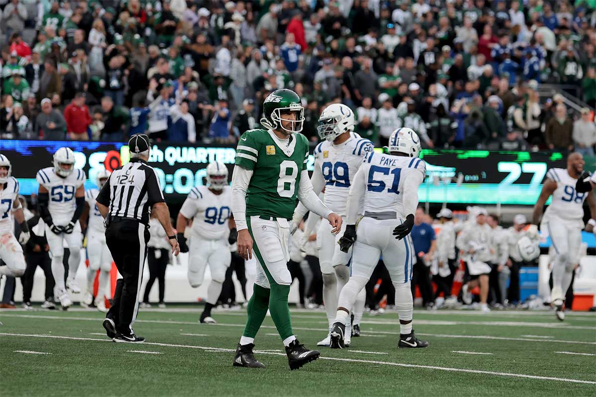 New York Jets quarterback Aaron Rodgers (8) walks off the field after losing to the Indianapolis Colts at MetLife Stadium.