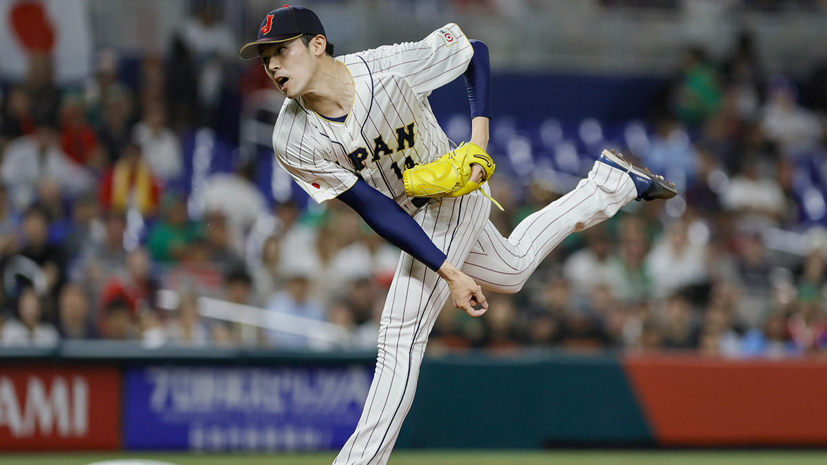 Japan starting pitcher Roki Sasaki (14) delivers a pitch during the first inning against Mexico at LoanDepot Park. 