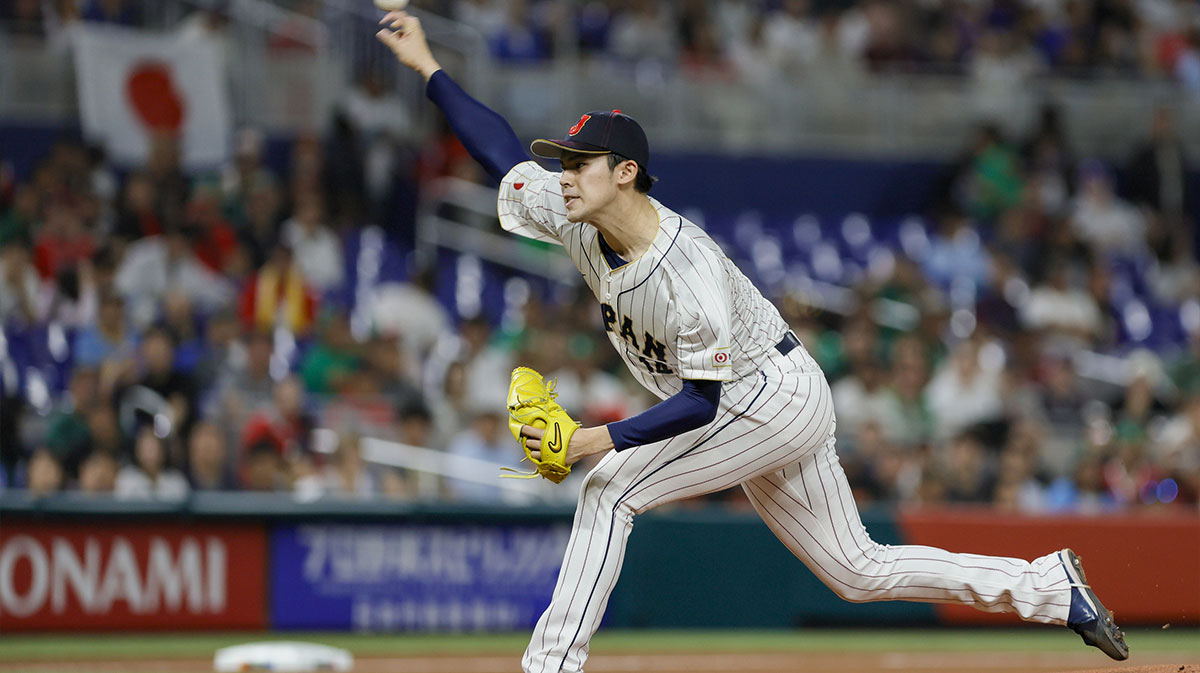 Japan starting pitcher Roki Sasaki (14) delivers a pitch during the first inning against Mexico at LoanDepot Park.