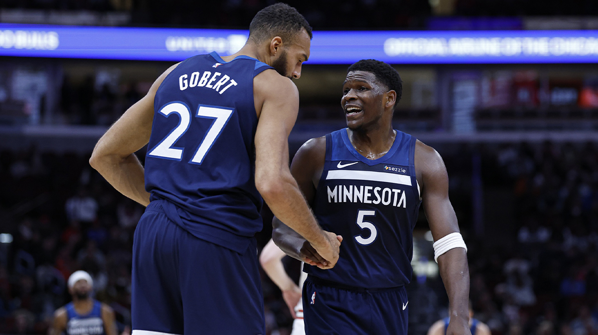 Minnesota Timberwolves center Rudy Gobert (27) reacts with guard Anthony Edwards (5) during the first half of an NBA game against the Chicago Bulls at United Center.