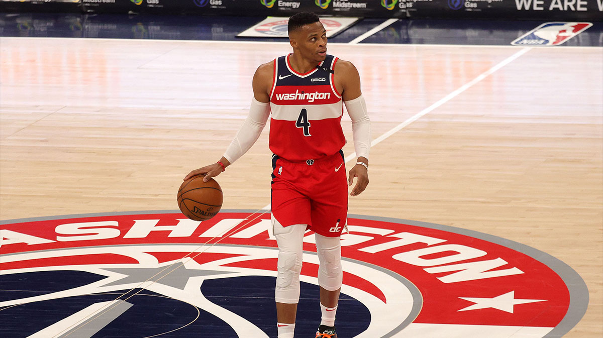 Russell Westbrook #4 of the Washington Wizards dribbles the ball against the Chicago Bulls in the first half at Capital One Arena.