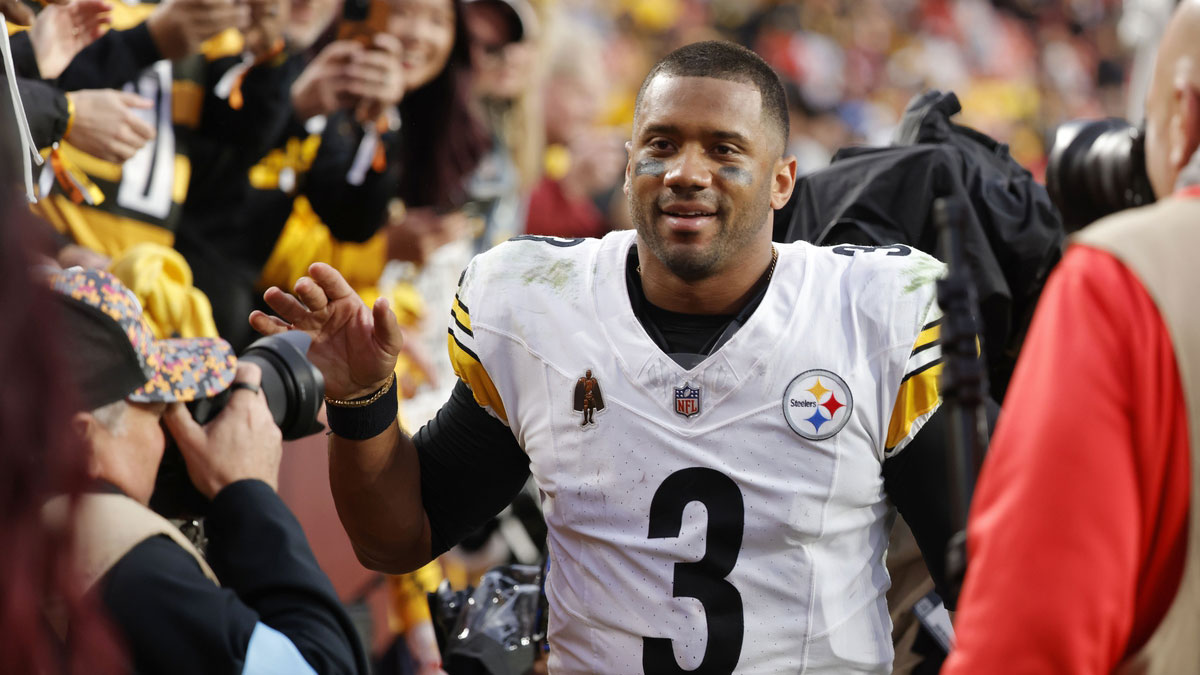 Pittsburgh Steelers quarterback Russell Wilson (3) celebrates with fans in the stands while leaving the field after defeating the Washington Commanders at Northwest Stadium.