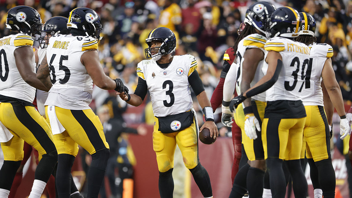 Nov 10, 2024; Landover, Maryland, USA; Pittsburgh Steelers quarterback Russell Wilson (3) celebrates with teammates after defeating the Washington Commanders at Northwest Stadium.