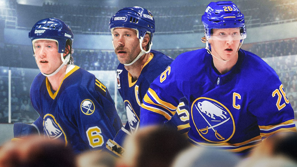 Sabres captain Rasmus Dhalin next to former Sabres defensemen Phil Housley and Mike Ramsey (in Sabres uniforms)