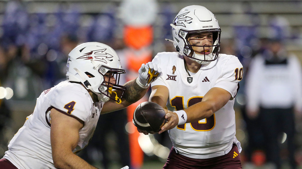 Arizona State Sun Devils quarterback Sam Leavitt (10) hands off to running back Cam Skattebo (4) against the Kansas State Wildcats during the second quarter at Bill Snyder Family Football Stadium.