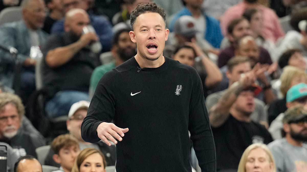 San Antonio Spurs acting head coach Mitch Johnson signals to players during the second half against the Los Angeles Lakers at Frost Bank Center. 