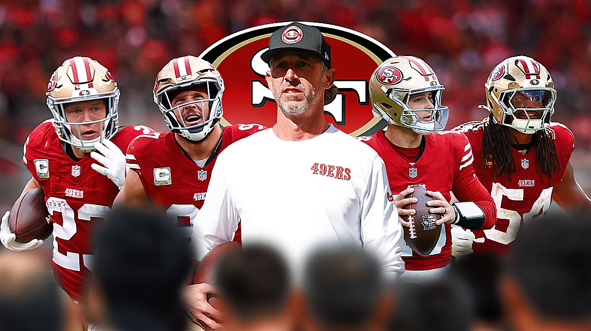 49ers Kyle Shanahan, Nick Bosa, Brock Purdy, Christian McCaffery, and Fred Warner with Shanahan at the center with the 49ers logo in the background