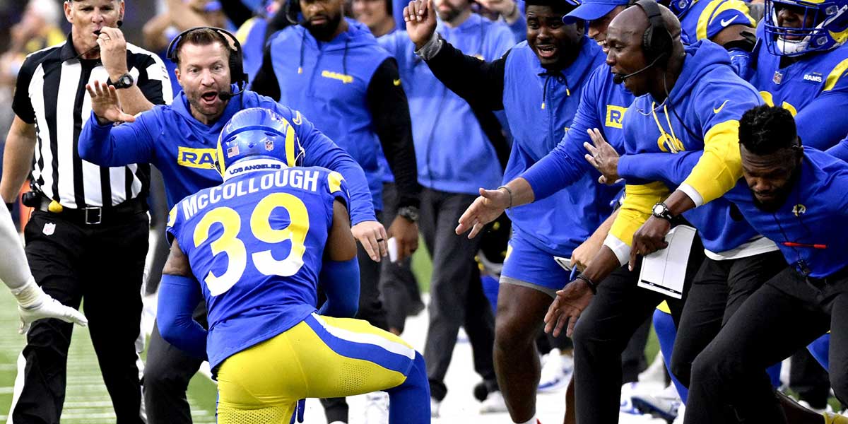 Los Angeles Rams head coach Sean McVay celebrates an interception by safety Jaylen McCollough (39) with the rest of the bench against the Las Vegas Raiders in the second half at SoFi Stadium