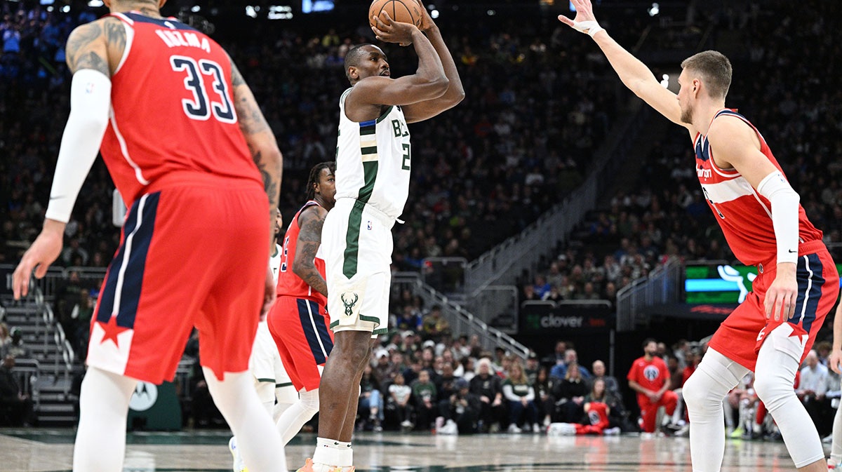 Milvaukee Bucks Next Serge Ibaka (25) Shooting the ball via Washington Vizards Center Kristaps Porzingis (6) in the second half at Fiserv Forum.