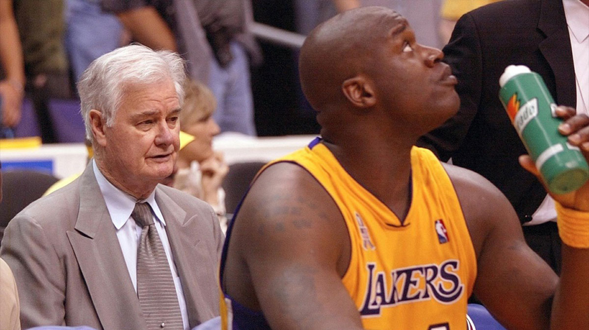 Los Angeles Lakers assistant coach Tex Winter sits behind the team bench during game 3 of the NBA Western Conference Finals at Staples Center. At right is center Shaquille O'Neal. The Sacramento Kings went on to win 103-90 to take a 2-1 lead in the series.