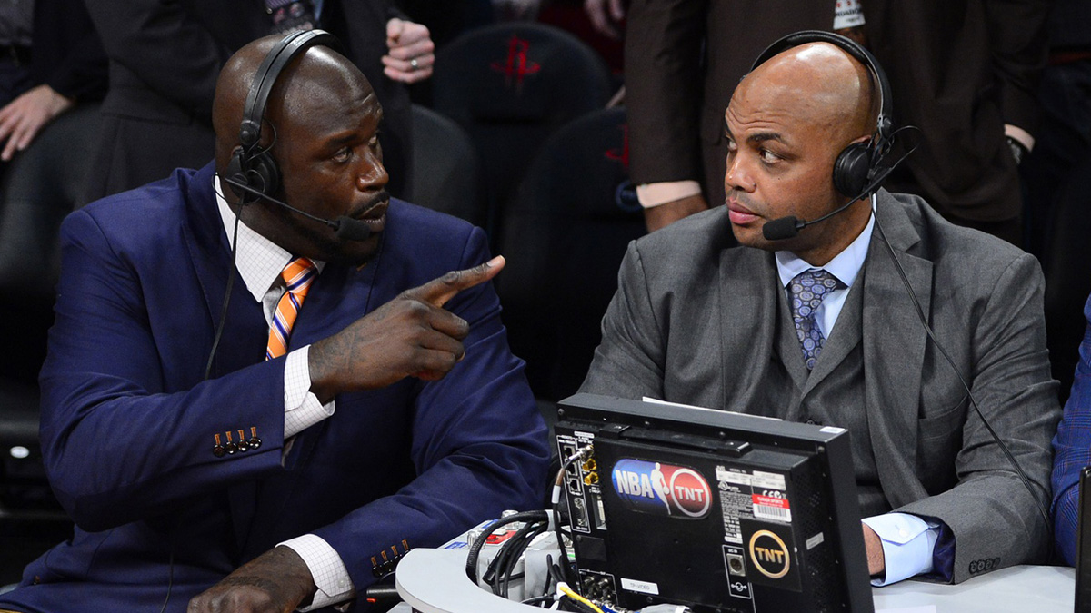 TNT broadcaster Shaquille O'Neal (left) and Charles Barkley talk during the 2013 NBA All-Star slam dunk contest at the Toyota Center