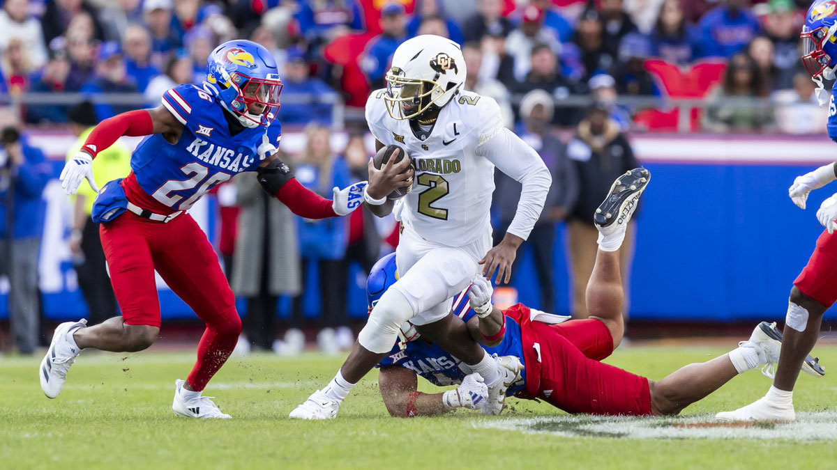 Colorado quarterback Shedeur Sanders (2) scrambles for yardage during the 2nd quarter between the Kansas Jayhawks and the Colorado Buffaloes at GEHA Field at Arrowhead Stadium.