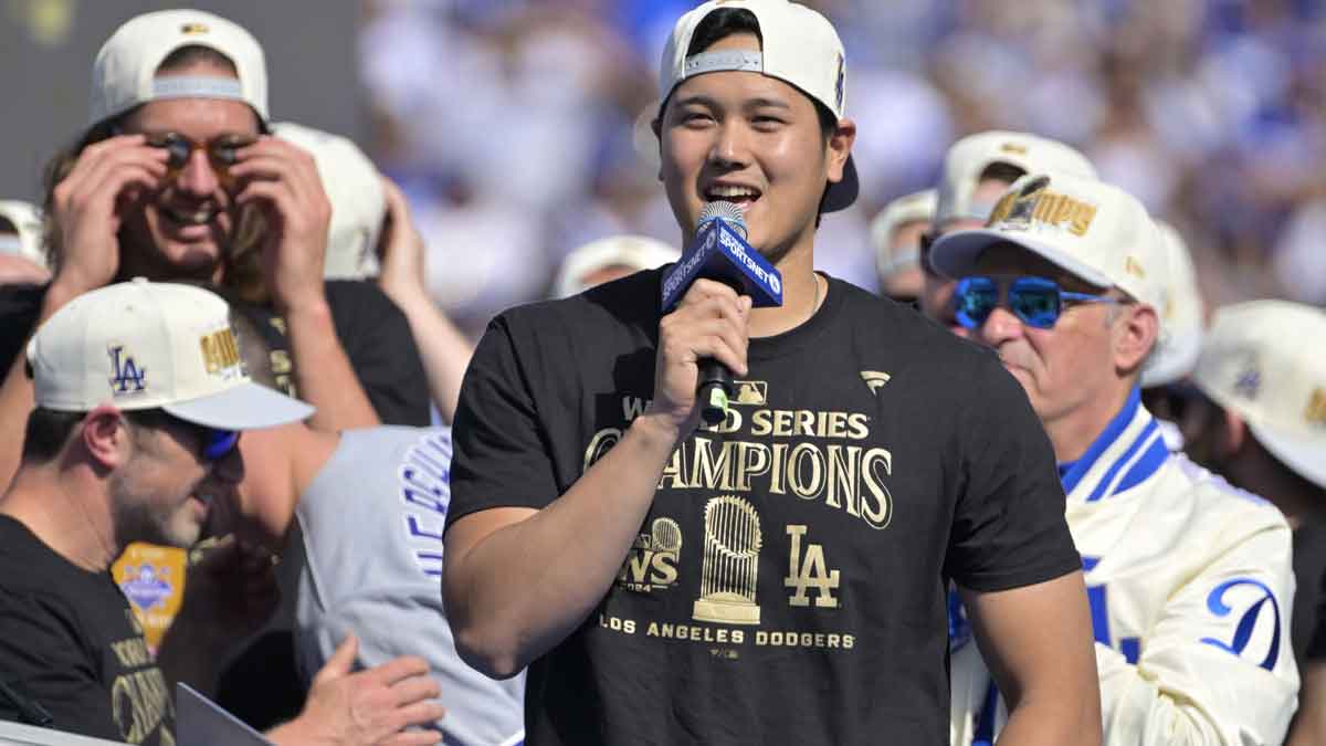 Los Angeles Dodgers designated hitter Shohei Ohtani (17) to speak to fans, in english, during the World Series Championship Celebration at Dodger Stadium. 