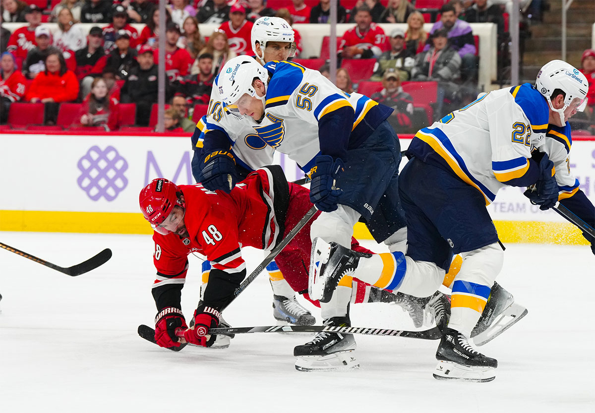 St. Louis Blues defenseman Colton Parayko (55) checks Carolina Hurricanes left wing Jordan Martinook (48) during the third period at Lenovo Center.