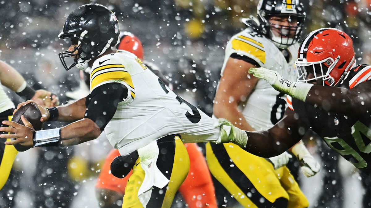 Cleveland Browns defensive tackle Dalvin Tomlinson (94) grabs the jersey of Pittsburgh Steelers quarterback Russell Wilson (3) during the second half at Huntington Bank Field.