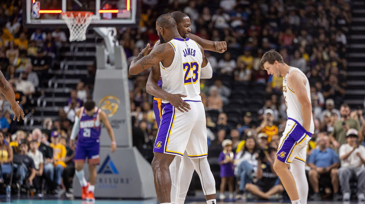 Phoenix Suns forward Kevin Durant (35) hugs Los Angeles Lakers forward LeBron James (23) during the pregame at Acrisure Arena. 