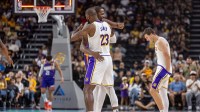 Phoenix Suns forward Kevin Durant (35) hugs Los Angeles Lakers forward LeBron James (23) during pregame at Acrisure Arena.
