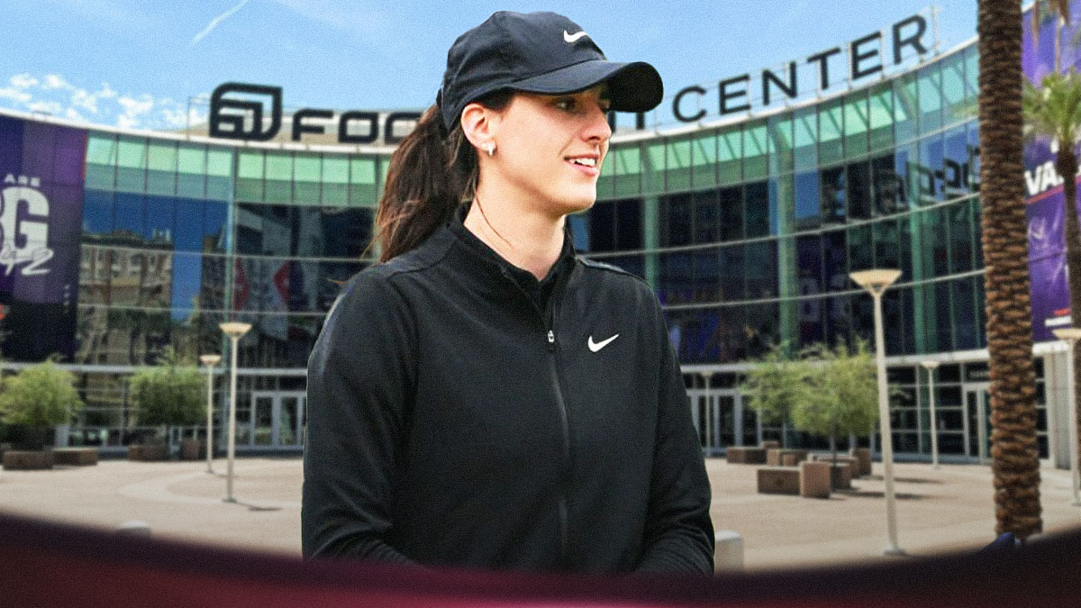 Caitlin Clark in street clothes with a background of the Footprint Center behind her